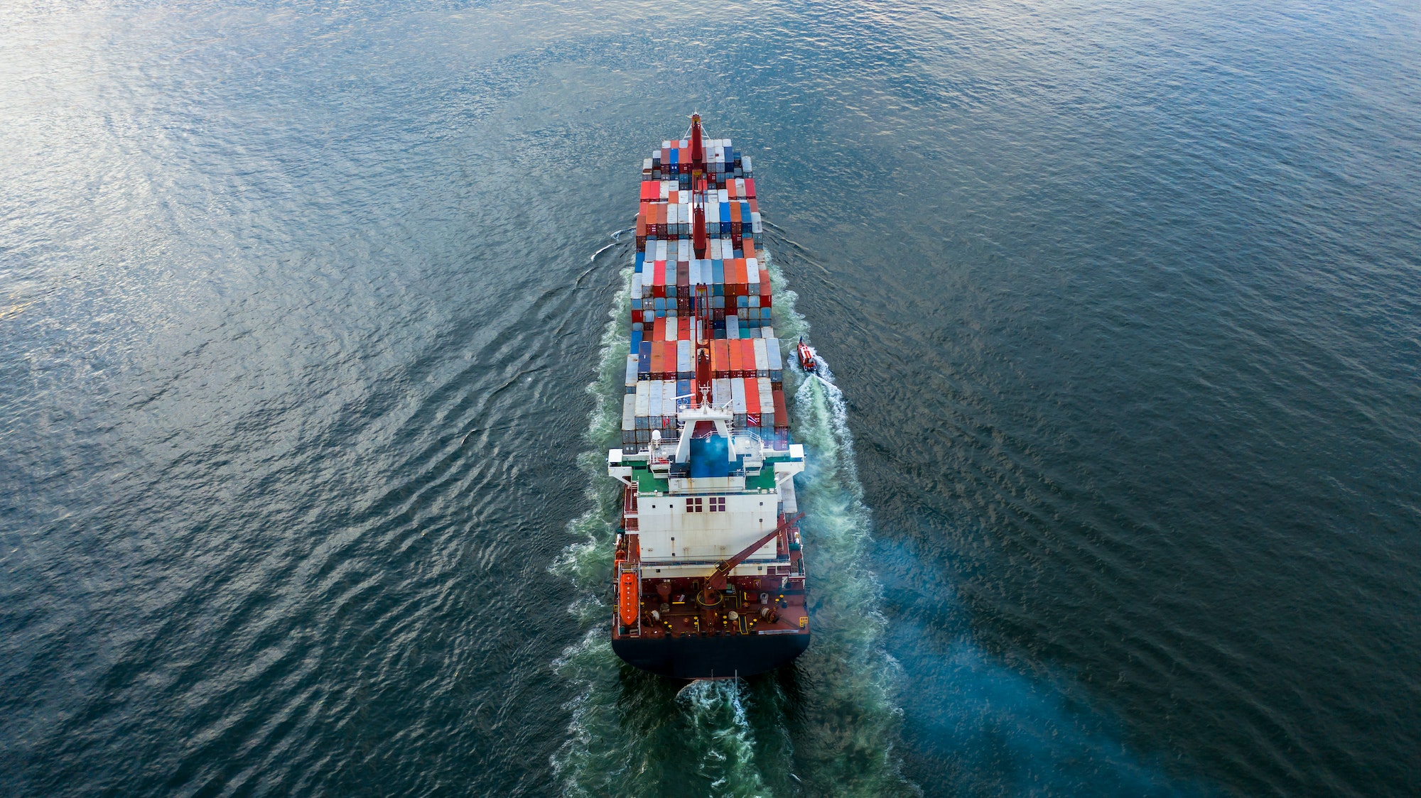 Aerial view container ship cargo freight shipping maritime vessel.